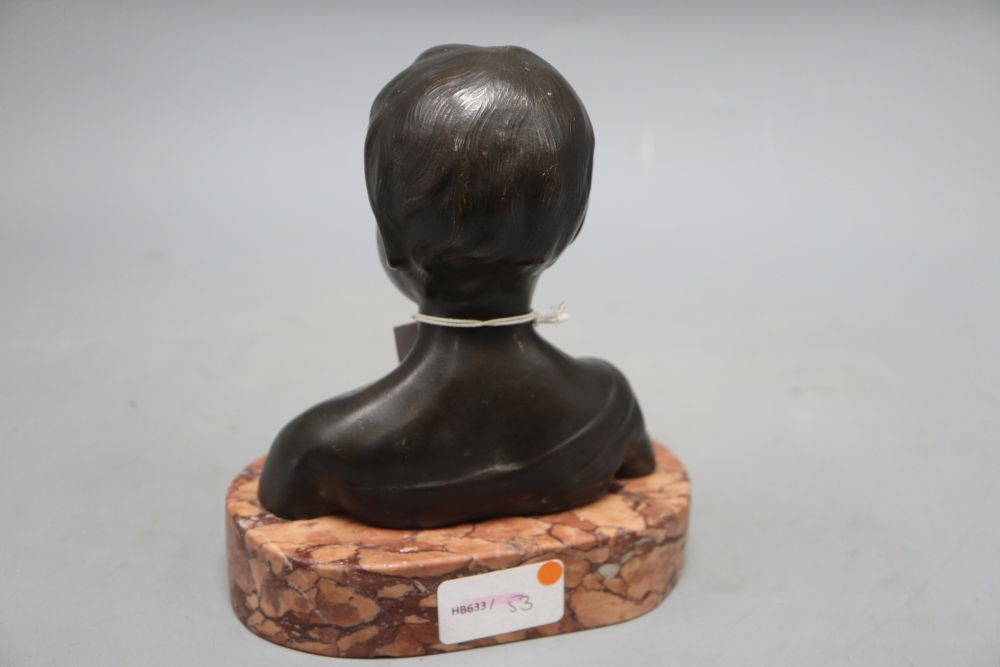 A bronze bust of a child, on marble base, unsigned, overall height 17cm